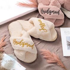 two slippers with bridesmaid written on them next to a pair of shoes