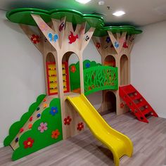 children's play area with slide and climbing wall