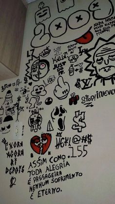 graffiti on the wall in a bathroom with many different types of writing and symbols all over it