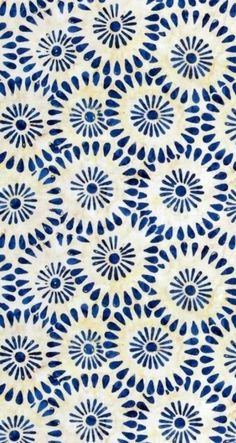 a blue and white background with an intricate design on it's surface, in the middle