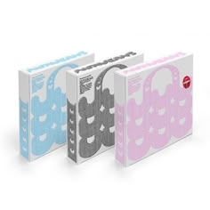 three different colored binders with the same pattern on them, one in pink and one in blue