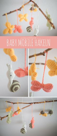 crochet baby mobile is hanging from a branch