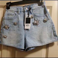 Juice Couture Jean Embellished Shorts Size 26 Chic Denim Shorts For Party, Casual High Rise Embellished Bottoms, Casual Embellished High Rise Bottoms, Embellished Blue Bottoms For Night Out, Trendy High Waist Embellished Bottoms, Trendy High Waisted Embellished Bottoms, Embellished High Rise Bottoms For Spring, Summer Embellished Blue Bottoms, Embellished Blue Bottoms For Summer