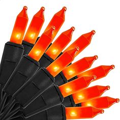 an umbrella with orange lights attached to it