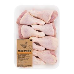 raw chicken wings in a plastic container on a white background with a free range label