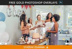 a group of women standing in front of a table with cake and confetti