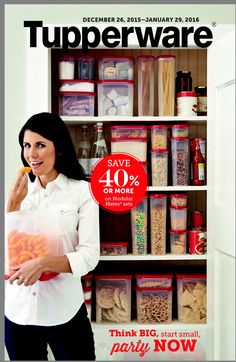 a woman standing in front of a pantry holding a box