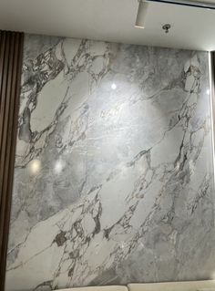 a large marble wall in an office building