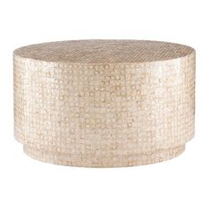 the round coffee table is made out of woven material and has a gold finish on top