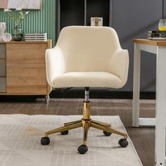 a white chair sitting on top of a rug in front of a desk and dresser