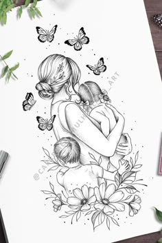 a drawing of a mother holding her child with butterflies flying around it on top of a table