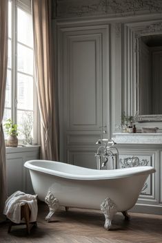 Parisian Flair Bathroom in a vintage modern master bath evokes Parisian elegance with clawfoot tubs, ornate vanities, and modern amenities like sleek fixtures and chic lighting. Click here for more Parisian bathroom ideas. Master Bath Ideas, Clawfoot Tubs, Modern Georgian, Modern Master Bath, Parisian Elegance, Vintage Opulence, Master Baths, Retro Color Palette