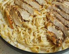 some chicken and noodles in a pan on the table