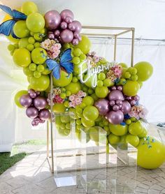 a bunch of balloons that are sitting on a table