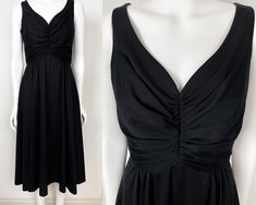 70s black flowy dress by Carnegie of London. Ruched bodice with a deep V-neck. Zipper in the back.  BRAND Carnegie of London SIZE Label says size UK 14 (US 10). Please see measurements below and also picture of label for size guide. CONDITION Very good! MATERIAL 100% Polyester MEASUREMENTS (Taken flat) Length: 107 cm Under Bust: 72 cm Shipping includes tracking. I try to ship within 1-2 business days. Please do not hesitate to contact me if you have any questions :) Black Flowy Floor-length Dress, Flowy V-neck Dress With Gathered Neckline, Black Flowy Viscose Dress, Vintage Black Silky Maxi Dress, Black Flowy V-neck Maxi Dress, Black Flowy Dress, Elegant Midi Dress, Elegant Midi Dresses, Ruched Bodice