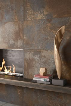 a modern fireplace with an abstract sculpture next to it and books on the shelf in front