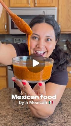 a woman is holding up a spoon with food in it to her face and the words mexican food by a mexican