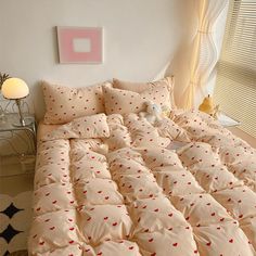 the comforter is made up with hearts on it