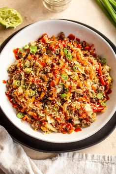 a white bowl filled with food on top of a table