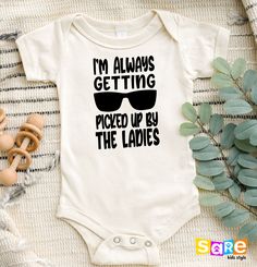 "I'm Always Getting Picked Up By The Ladies Onesie®, Cute Baby Clothes, Funny Bodysuit For Boys, Funny Baby Boy Clothes, Cute Kids Shirt, Funny Tees, Mommy's Girl Shirt, Girls Birthday Gift, Birthday Girl, Cute Baby Bodysuit, Funny Shirt for Girls, Toddler Girl's Shirt,, Cute Baby Onesie®, Funny Toddler Youth Shirt, Natural Newborn Girl Shirt, Cute Baby Clothes, Gift for Newborn, Babyshower Gift, Babyshower Shirt, Newborn Girl Gift, Kids Horse Shirt Welcome to SareKidsStyle! HOW TO ORDER * Pleas Cute White Onesie For Father's Day, Funny Boy Onesies, Baby Clothes Gift, Baby Clothes Funny, Baby Boy Clothes Funny, Onesie Ideas, Funny Baby Shirts, Funny Baby Boy, Funny Toddler