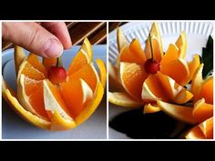 there are oranges cut in half and placed on a plate with cherries attached to them