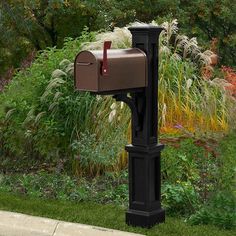 a mailbox in the middle of a garden