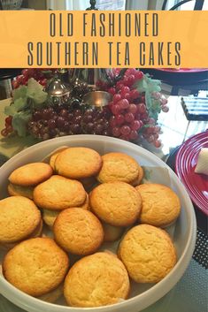 old fashioned southern tea cakes in a white bowl on a table with red plates and grapes