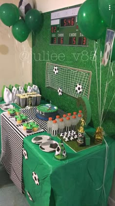 a soccer themed birthday party with green and black decorations