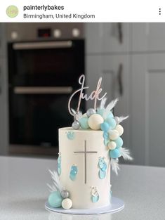 a white cake with blue and white decorations