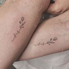 two people with tattoos on their legs sitting next to each other and one has the word love written in cursive writing