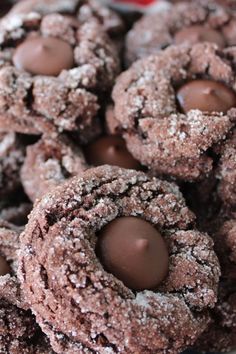 chocolate covered cookies are piled on top of each other