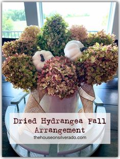 dried hydrangea fall arrangement with pumpkins