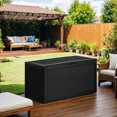 an outdoor living area with furniture and plants