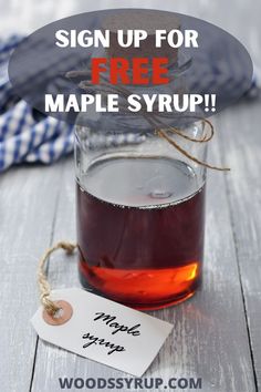 a jar filled with maple syrup next to a tag that says, sign up for free maple syrup