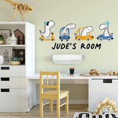 a child's room with dinosaur decals on the wall and toys in the playroom