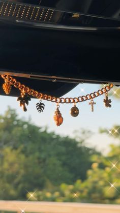 Add some ✨charm✨ to your car in a minimalist yet personalized way! Each Car Charmie (or Carmie) comes with 7 charms of your choice. Please make note of desired charms! Due to the random nature of rearview mirror styles, your Charmie will be shipped with a piece of thick wire to use as a hanger that can conform the necessary position. Rearview Mirror Decoration Aesthetic, Car Mirror Charm Diy, Cute Car Charms, Jeep Car Decor, Passenger Princess Decor Car Ideas, Rearview Mirror Decal, Taylor Swift Car Decor, Car Inside Decorations, Cute Ways To Decorate Your Car