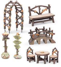 a collection of miniature wooden furniture and decor items, including a bench with flowers on it