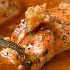 a piece of salmon being eaten with a fork