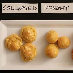 four different types of doughnuts on a white platter with labels that read collapsed, doughnut