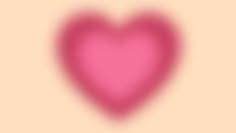 a pink heart shaped object on a beige background