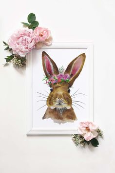 a painting of a rabbit wearing a flower crown on it's head next to pink flowers