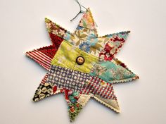 Recycled vintage quilt pieces 8 point star large 8 1/2 inch decoration, ornament which can be hung on a peg rack, wall, door, friend gift, handmade from old feedsack and calico time worn quilt pieces with another old quilt on the reverse side, it has a vintage linen cord hanger, the hanger can be removed for flat display, decoration, hanger or gift, these are hand cut from a recycled vintage quilt, about 8 1/2 inches in diameter with an antique china butter decoration in the center, there is a ruler in one picture for size reference, each ornament I make is different and made from all old materials which I love to work with. All items guaranteed to be vintage. Shipping is automatically combined for multiple item orders in my shop. Butter Decoration, Quilt Retreat Favors, Quilted Star, Quilt Crafts, Christmas Quilting Projects, Feedsack Quilt, Peg Rack, Quilt Retreat, Scrappy Quilt Patterns