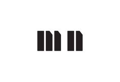 the letter m is made up of three vertical lines, and it appears to be black