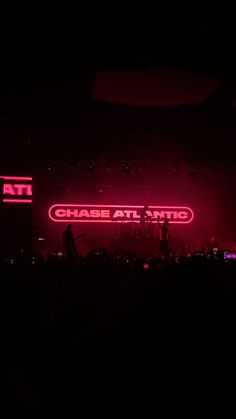 the stage is lit up with red lights