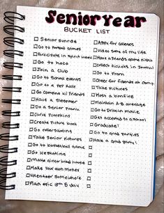 a notepad with the words'senior year bucket list'written in red ink