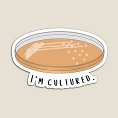 i'm cultured sticker with an orange liquid in the bottom and white lettering