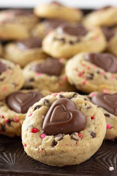 chocolate chip cookies with hearts and sprinkles on a tray