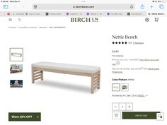 the bench is made from wood and has white fabric