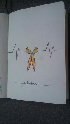 an open book with a drawing of a bow on it's side and heartbeat