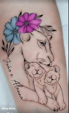 a woman's thigh with a lion and flowers on it